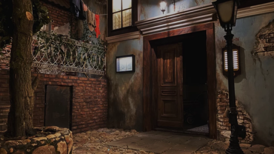 A World War II period alley from 'Warsaw Uprising' by Black Cat Escape Room.